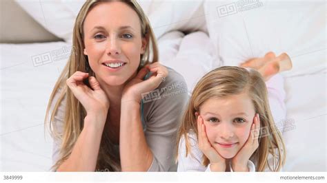 blonde mother and daughter posing stock video footage 3849999
