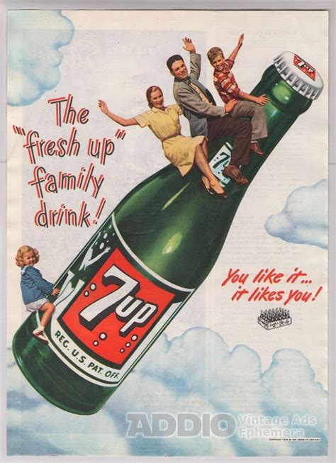 advertisement     people sitting  top   large beer bottle