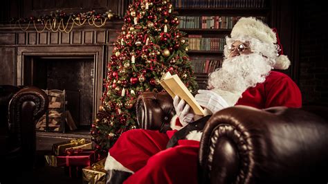 santa claus  sitting  sofa  reading book  christmas tree hd