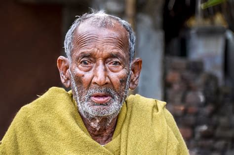 A Poor Indigenous Old Man Of India Looks At The Camera With Astonished
