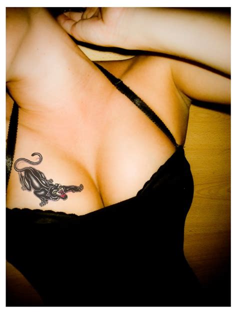 isyulli amor vincit omnia chest tattoo
