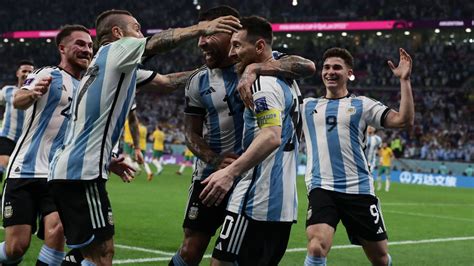 argentina 2 1 australia messi marks 1000th game with goal and world