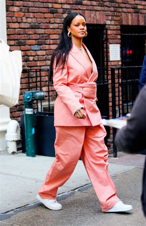 rihanna remixes the business suit with a street style staple rihanna