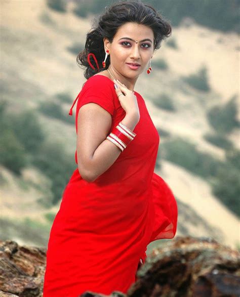 kerala mallu aunty aarti in sexy red saree posing hot erotic stills for a item song bulging