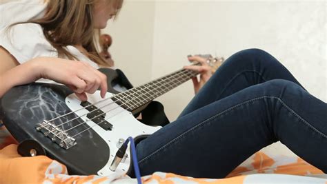 teen girl playing guitar at home stock footage video 3358673 shutterstock