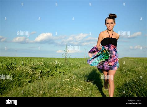 teenage female model from poland girl running with colorful dress