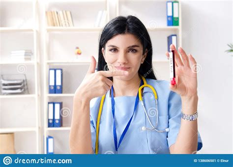 The Middle Aged Female Doctor Working At The Clinic Stock Image Image