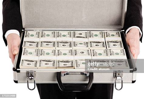 Suitcase Full Of Money Photos And Premium High Res Pictures Getty Images