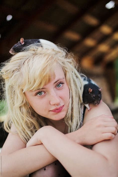 pale russian grunge pretty girl with dreadlocks holding rats by