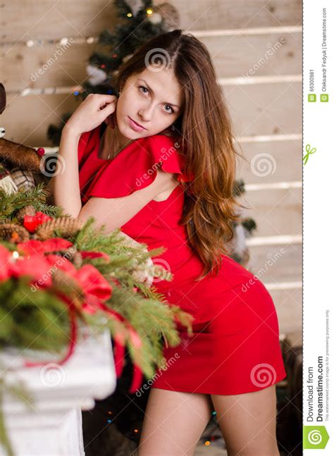 fashion interior photo of beautiful girls with blond hair wear luxurious party dresses and santa