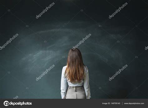 businesswoman   empty blackboard stock photo  dragonstock