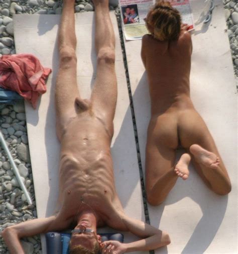 nude teen friends play around at a public beach pichunter