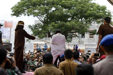 gay indonesians caned in front of jeering crowd in aceh