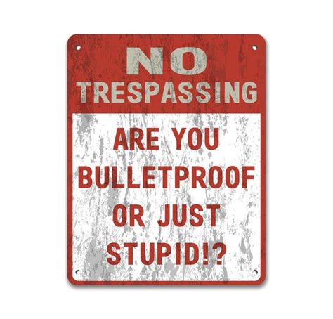 trespassing   bulletproof   stupid metal sign