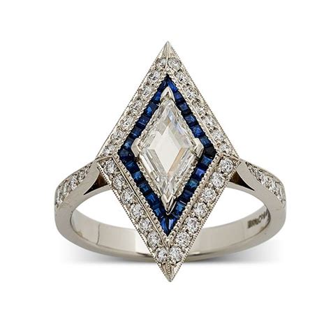 lozenge shaped central diamond  sapphires engagement ring  vintage diamond