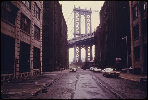 filemanhattan bridge tower  brooklyn  york city framed  nearby buildings