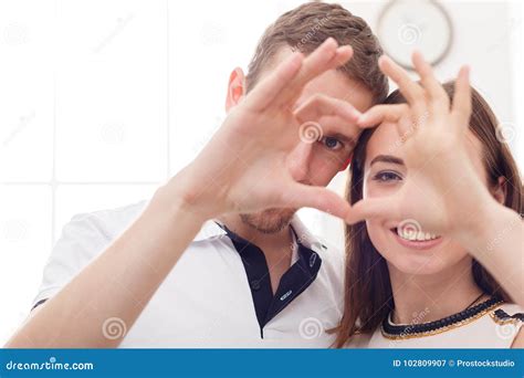 happy couple making love sign with the fingers stock image image of