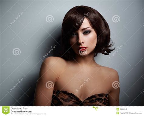 Sexual Woman With Black Short Hair Looking On Dark
