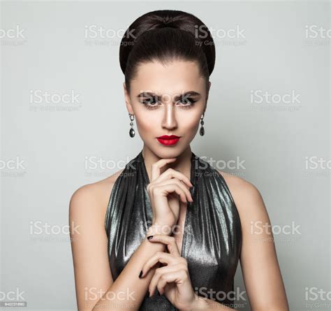 beautiful fashion model woman with party makeup and event hairstyle