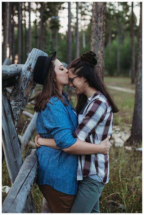 a wyoming wilderness engagement shoot with a rainbow flag lesbian
