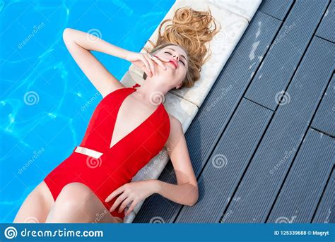 Beautiful Woman Relaxing In Swimming Pool Blonde Girl