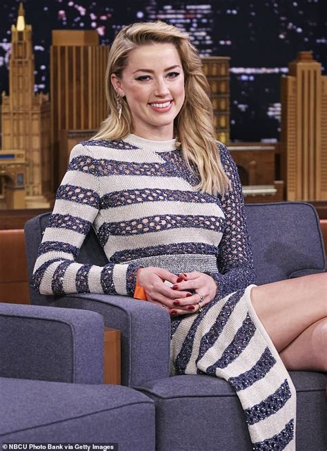 amber heard looks stunning in maxi dress with a slit while discussing