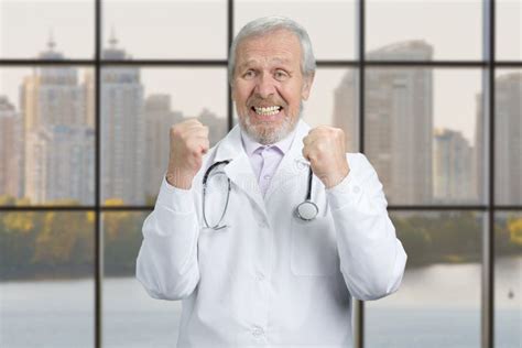 happy  doctor rejoicing stock image image  elderly amazement