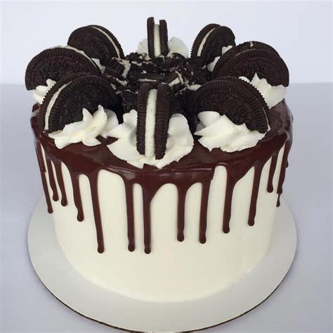 oreo drip cake chocolate cake filled with vanilla buttercream and