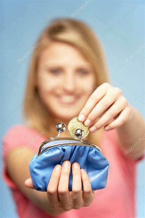 teenage girl holding purse stock photo  cmonkeybusiness