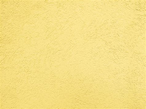 butterscotch yellow textured wall close  picture  photograph