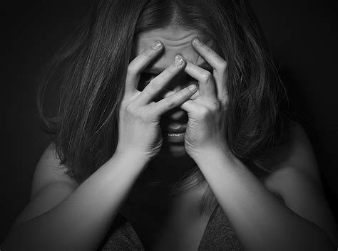 sad woman  depression  despair crying covered  face  black dark background   box