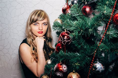 beautiful blonde near a christmas tree ~ people photos ~ creative market