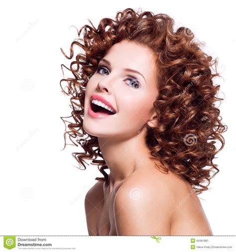 beautiful laughing woman with brunette curly hair stock