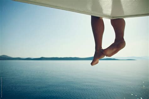 Dangling Legs Over The Side Of A Boat By Denni Van Huis Water Legs