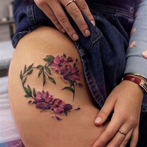purple flowers on an upper side thigh best tattoo ideas tattoo ideas 45