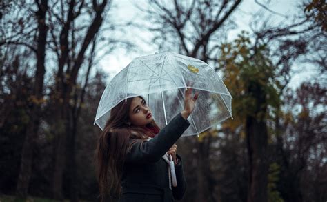 human person umbrella woman holding clear woman holding clear