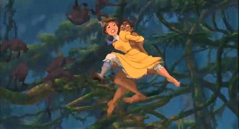 jane being carried by tarzan as tarzan is saving jane from the angry