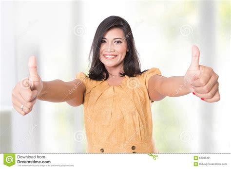 Mature Asian Woman Posing At The Camera Showing Two Thumbs Up Stock