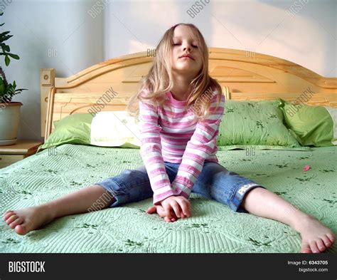 Young Girl Sitting On Bed Image And Photo Bigstock