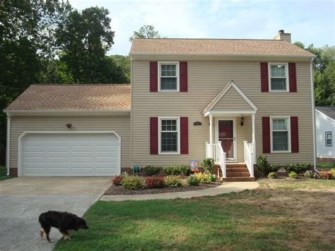 tan house with shutters