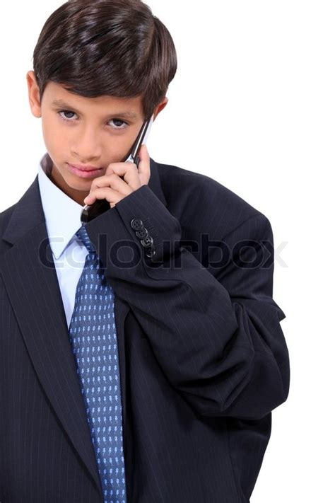 young boy dressed   adults business suit stock photo colourbox