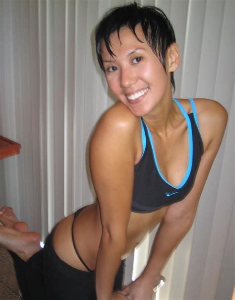 shorthaired asian chick wearing micro bikini teasing with her body