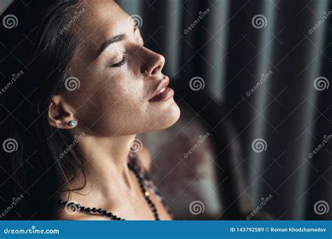 Side View Of Portrait Of Sensual Brunette Girl With Closed Eyes And