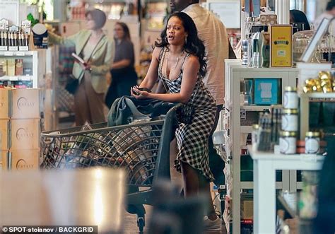 rihanna wears low cut black dress as she stocks up on food at an italian grocery store daily