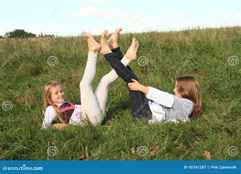 Girls Lying In Grass Stock Image Image Of Feet Girl 45761287