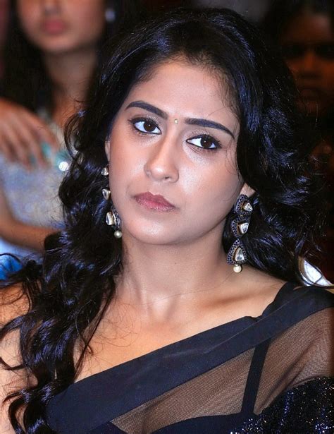 desi actress pictures regina cassandra flashing her yummy cleavage and navel in a black saree