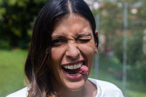 Latina Woman Smiling And Showing Tongue Outside Stock Image Image Of