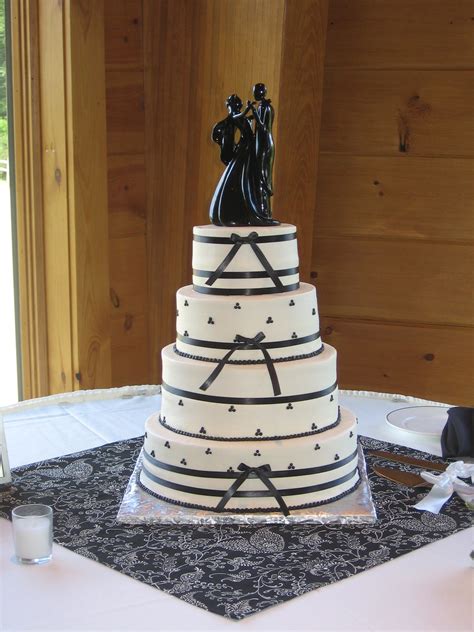 4 tier round buttercream black and white wedding cake