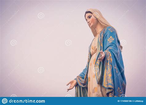 The Blessed Virgin Mary Statue Figure In A Sunset Time