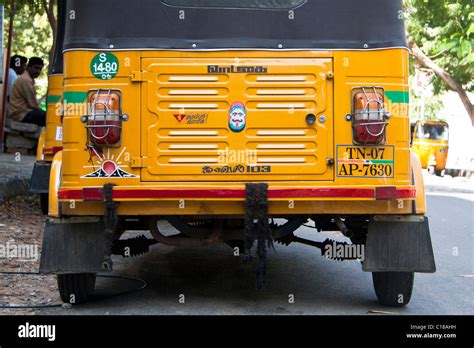 indian yellow auto rickshaw  res stock photography